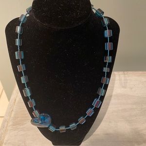 Unique handcrafted glass bead and heart necklace.